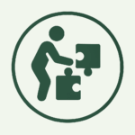 Icon of a person assembling puzzle pieces inside a circle.
